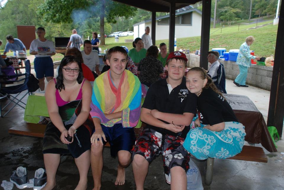Smiling young people at the picnic