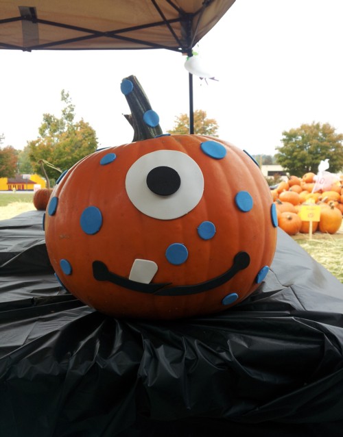 pumpkin decorated with one large eye