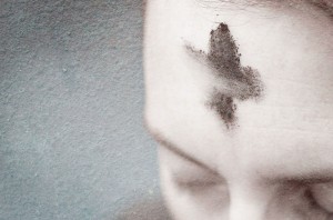 woman with cross made of ashes on her forehead