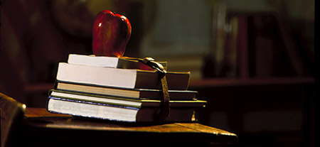 school books with an apple