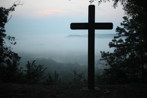 cross with mountain view