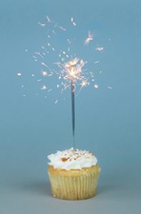 sparkling candle in a cupcake