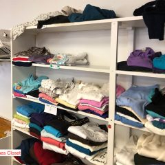 Shelves full of folded clothes