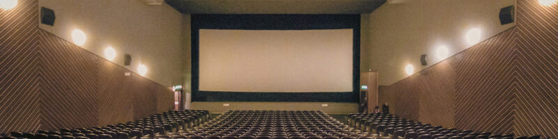 movie screen and rows of seats in a theater