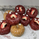 Cake donuts with candy eyes and teeth